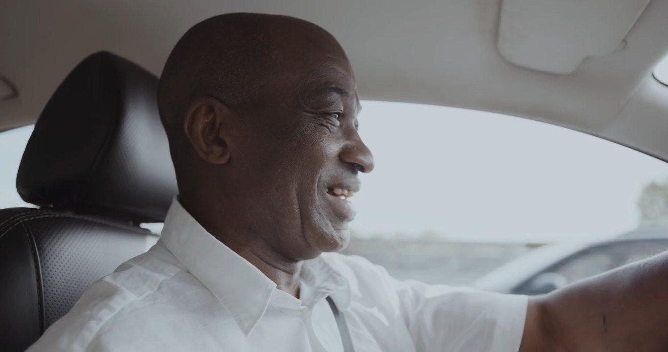 Smiling Patch driver at the wheel